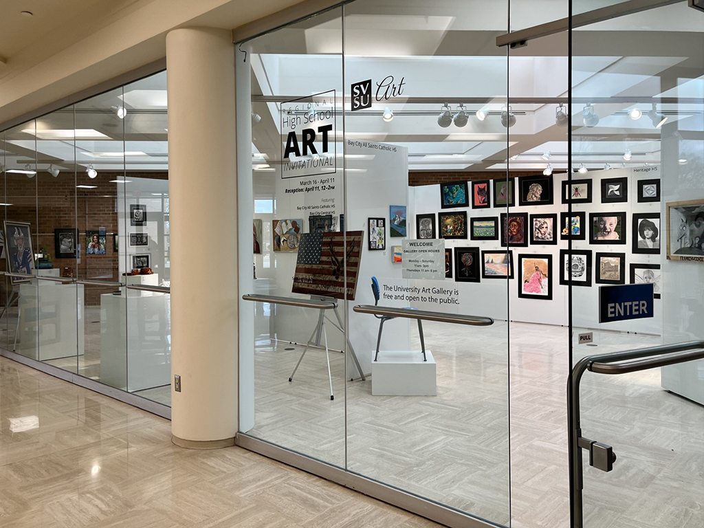 Winter 26 high school invitational front door with list of participating hs and art work from bc all saints, heritage, freeland and birch run work visibile, various media